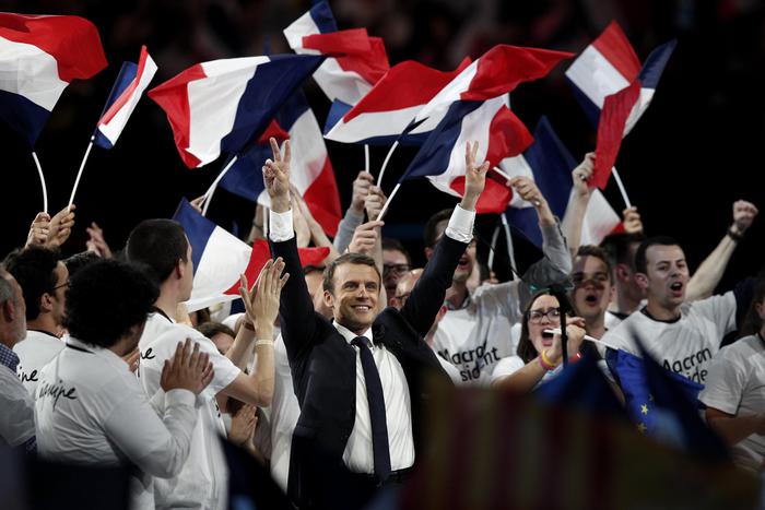 epa05946110  (FILE) A file picture dated 17 April 2017 shows French presidential election candidate from the centrist 'En Marche!' (Onward!) political party, Emmanuel Macron (C) gesturing toward the audience after making his speech, during his political campaign rally at the AccorHotels Arena, in Paris, France. Emmanuel Macron's campaign announced on 05 May 2017 it has been the victim of hacking after nine gigabyte of emails purporting to belong to the campaign were posted online.  EPA/YOAN VALAT