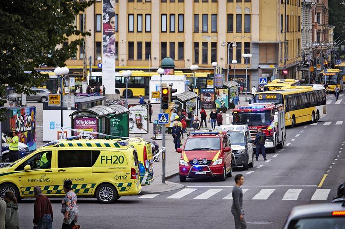 epa06150167 Ambulance cars gather at the site of a multiple stabbing on the Market Square in Turku, Finland, 18 August 2017. According to media reports on 18 August several people were injured in a stabbing spree on two market squares in the city. Finnish police shot at and apparently injured the stabber and were reported to search for possible other perpetrators.  EPA/ARI MATTI RUUSKA/TURUN SANOMAT FINLAND OUT