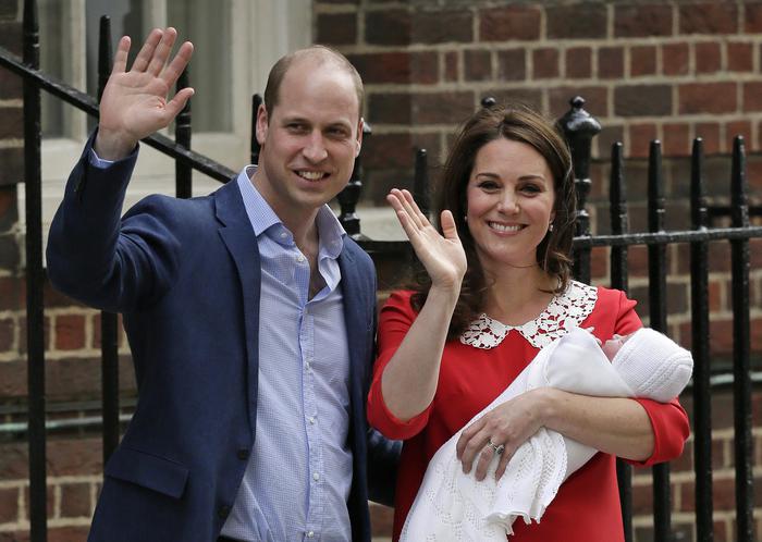 Britain's Prince William and Kate, Duchess of Cambridge wave as they hold their newborn baby son as they leave the Lindo wing at St Mary's Hospital in London London, Monday, April 23, 2018. The Duchess of Cambridge gave birth Monday to a healthy baby boy  a third child for Kate and Prince William and fifth in line to the British throne. (ANSA/AP Photo/Tim Ireland) [CopyrightNotice: Copyright 2018 The Associated Press. All rights reserved.]