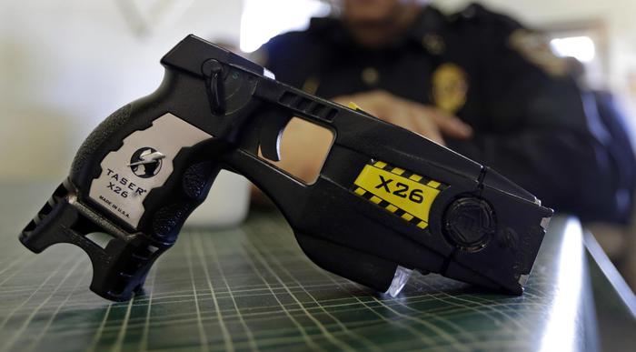 FILE - This Nov. 14, 2013, file photo, shows a Taser X26 on display. Shares in Axon Enterprises, the maker of Taser stun guns, have fallen more than 6 percent after the company admitted it had not replied to Securities and Exchange Commission inquiries due to miscommunication issues. In a filing with the SEC on Thursday, Oct. 19, 2017, Axon said it had just become aware of the inquiries from the agency and was working to resolve the matter. (ANSA/AP Photo/Michael Conroy, File) [CopyrightNotice: AP2013]