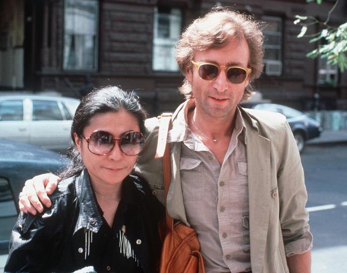 FILE - In this Aug. 22, 1980, file photo, John Lennon, right, and his wife, Yoko Ono, arrive at The Hit Factory, a recording studio in New York City. The death of Lennon, shot 35 years ago, still reverberates as a defining moment for a generation and for the music world. (ANSA/AP Photo/Steve Sands, File)