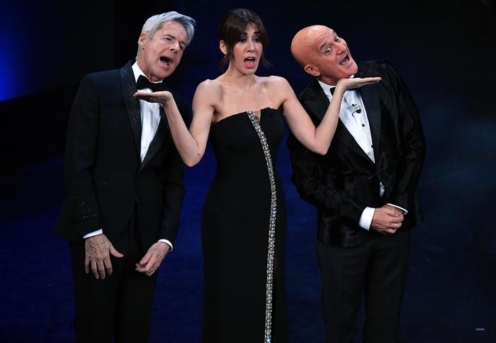 (L-R) Italian singer and Sanremo Festival artistic director Claudio Baglioni, Italian actress Virginia Raffaele and Italian actor Claudio Bisio perform on stage at the Ariston theatre during the 69th Sanremo Italian Song Festival, Sanremo, Italy, 05 February 2019. The Festival runs from 05 to 09 February. ANSA/ETTORE FERRARI