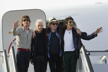 FILE - In this March 24, 2016 file photo, members of The Rolling Stones, from left, Mick Jagger, Charlie Watts, Keith Richards and Ron Wood pose for photos from the plane that brought them to Cuba at Jose Marti international airport in Havana, Cuba. The band is scheduled to play Friday, June, 21, 2019 at Soldier Field in Chicago after a postponing their North American tour because frontman Mick Jagger needed medical treatment. A second show is scheduled for Tuesday at Soldier Field. (ANSA/AP Photo/Ramon Espinosa File) [CopyrightNotice: Copyright 2019 The Associated Press. All rights reserved.]