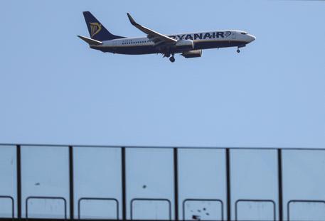 epa07059095 A Ryanair plane fly over Commerzbank Arena in Frankfurt Main, Germany, 30 September 2018. In the last days Ryanair cabin crews in Belgium, Germany, Italy, the Netherlands, Portugal and Spain have also gone on strike in a row over contracts and conditions, with unions demanding that staff be hired under contracts in the countries where they are based instead of under Irish law.  EPA/ARMANDO BABANI