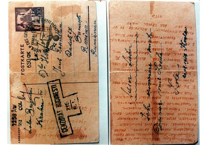 The two sides of a postcard, sent from the Auschwitz concentration camp in 1943 via the Jewish underground, show once-invisible writing detailing the horrors of genocide. The card was recently discovered among a survivor's collection donated to the Yad Vashem Holocaust Museum in Jerusalem. The secret writing tells of  " death camp, hunger, killing by gas "  and details of the Jewish underground.   MENAHEM KAHANA/ANSA